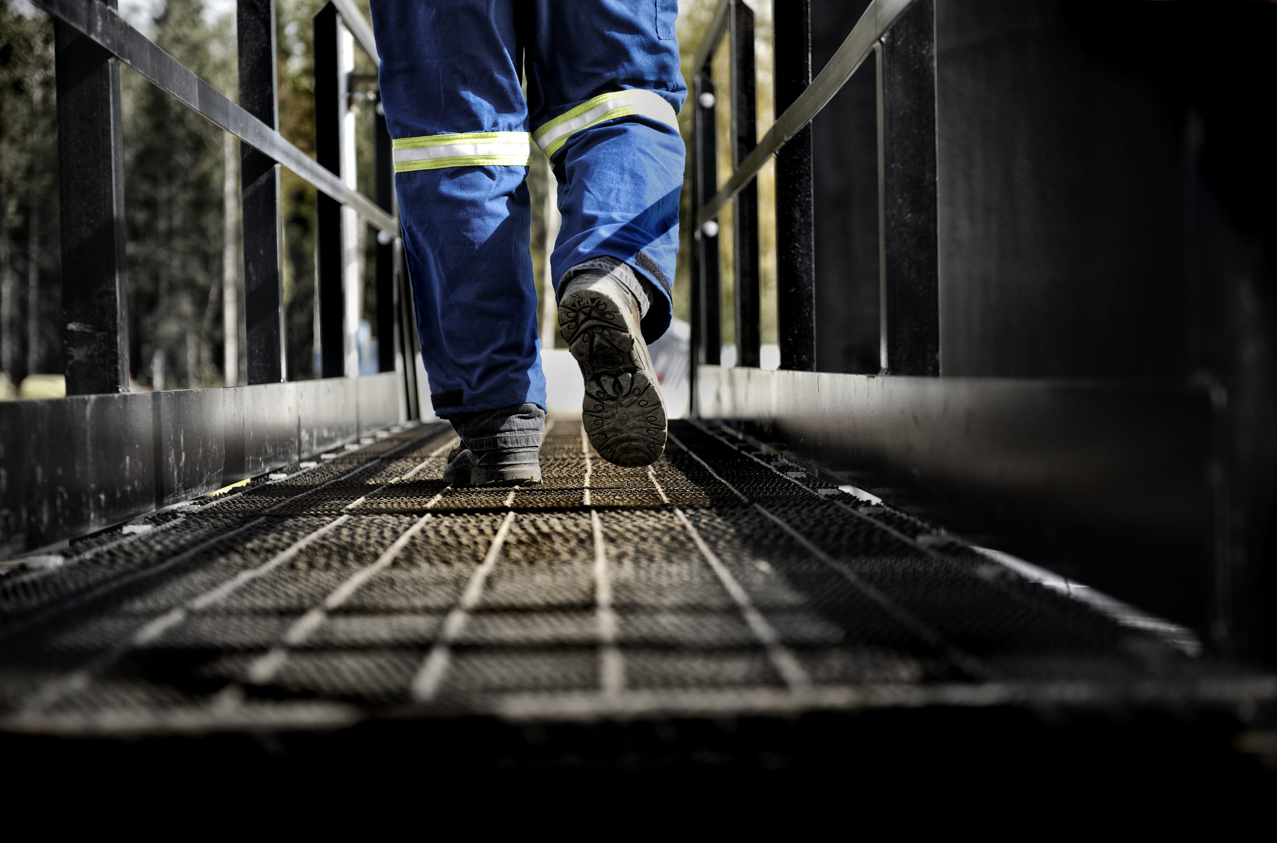 Organizational Restructuring Oil Rig Worker On Walkway