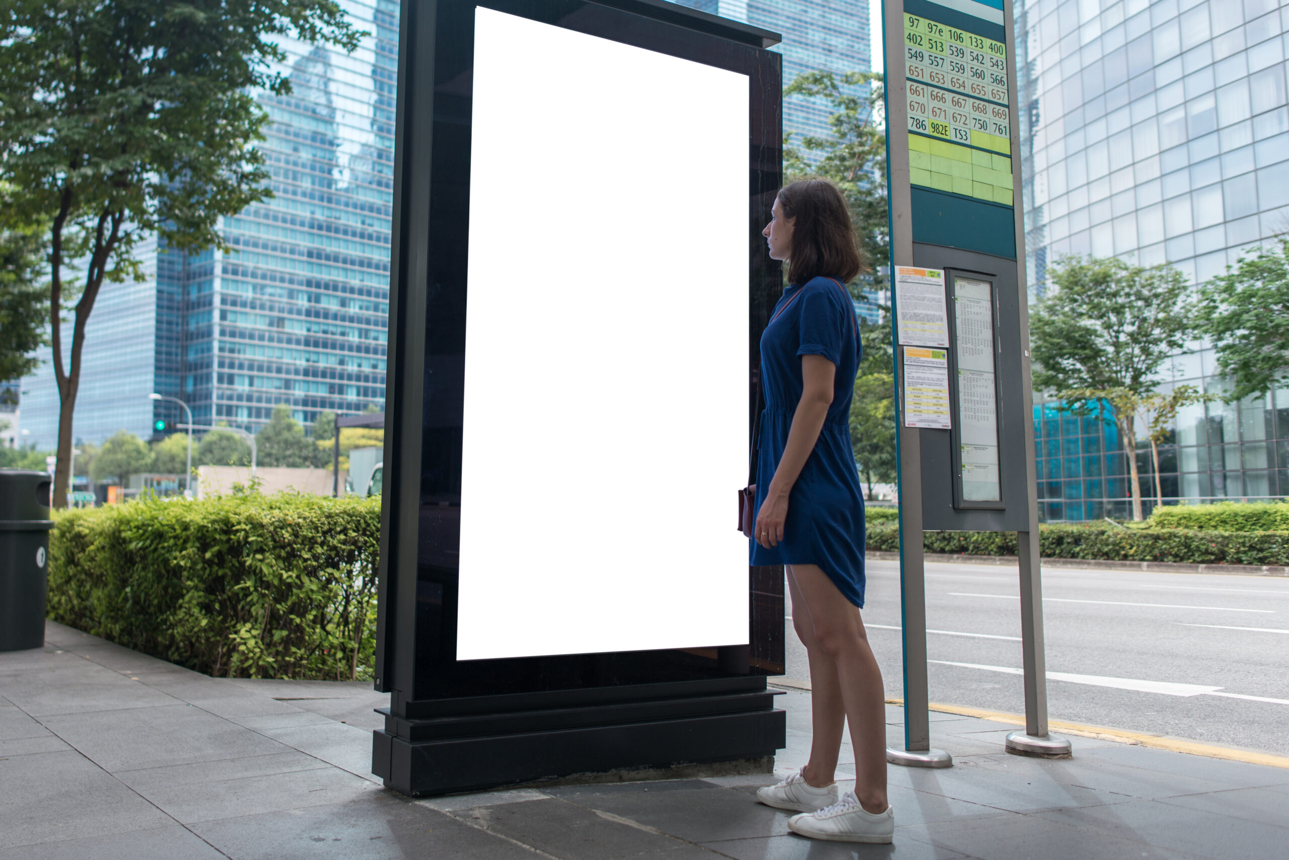 Stack'd Consulting -Woman Standing Near Blank Advertising Lightbox On The Bus Stop, Mock Up